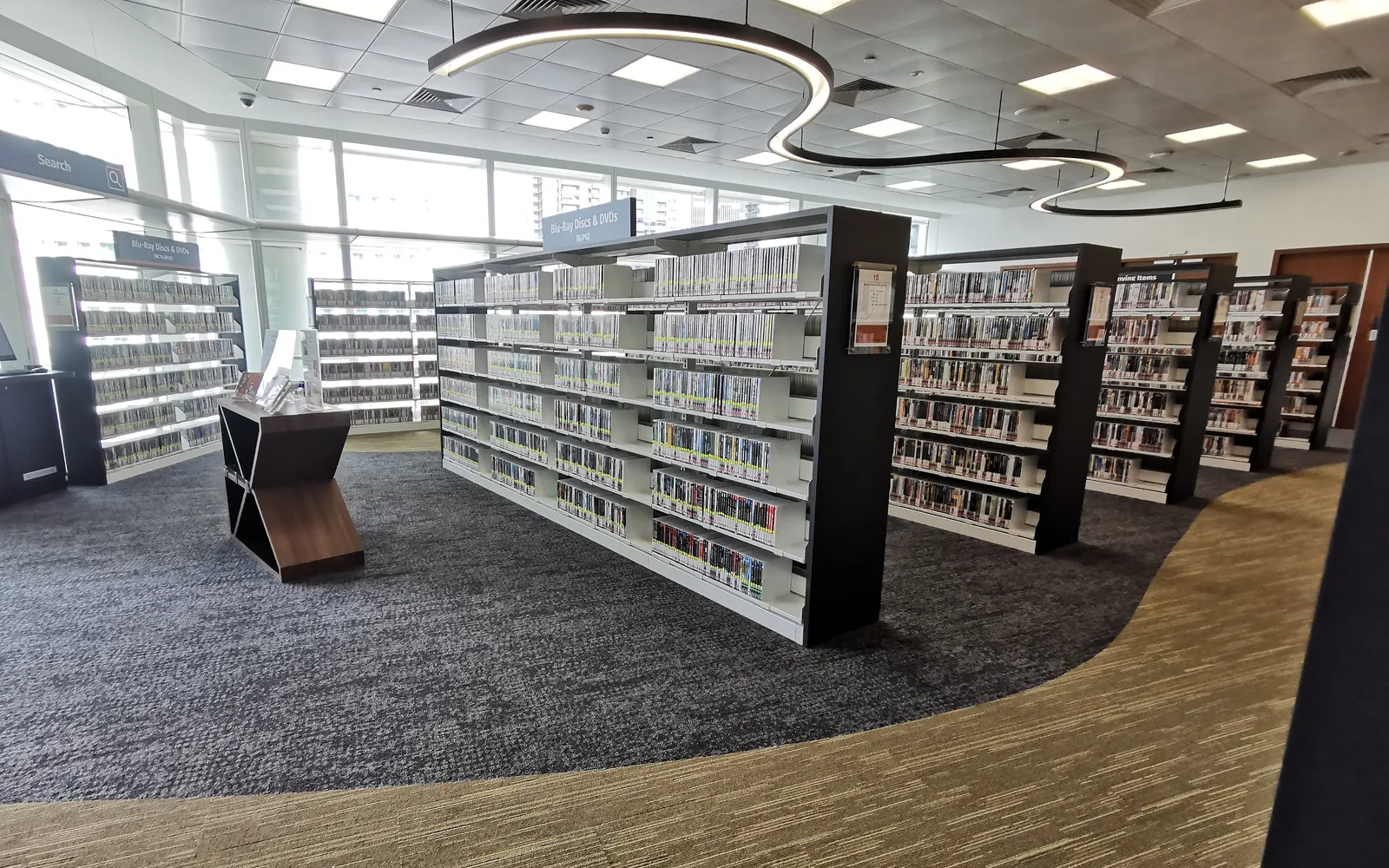Bookshelves and reading spaces at Central Arts Library in Singapore’s National Library Building.