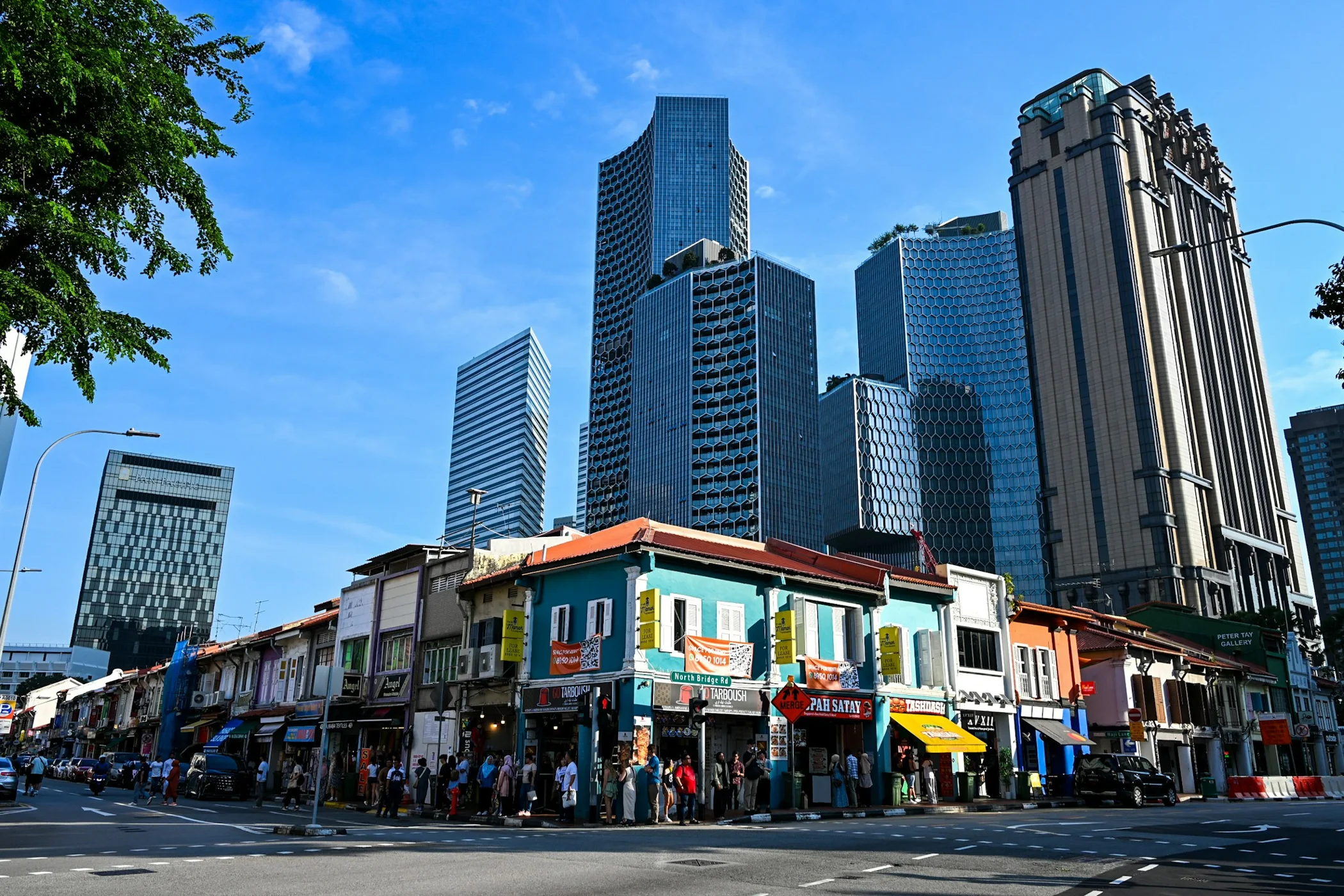 Conserved shophouses against Singapore’s modern skyline